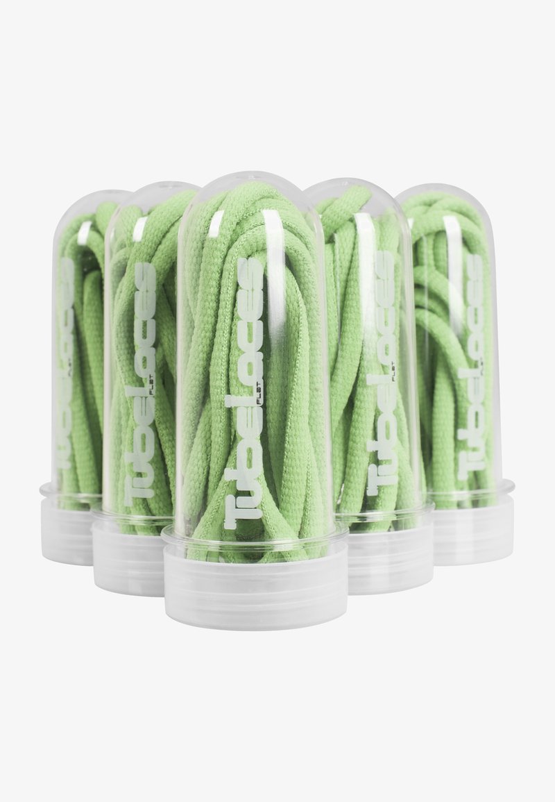 Flat shoelaces in bright green, packaged in clear plastic tubes with white branding. The laces feature a textured weave.