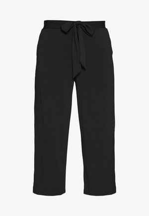 Pantalons noirs avec une taille à nouer, coupe loose et jambes droites. Réalisés dans un tissu léger et doux au toucher.