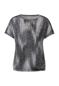 T-shirt graphique à manches courtes en gris et noir avec un motif léopard, portant le texte "FAIS CONFIANCE À TON MOMENT" en accents brillants.