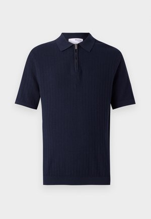 Marine kortærmet polo skjorte med struktureret ribbet design og halvlukning med lynlås. Har krave i klassisk stil og glat stof.