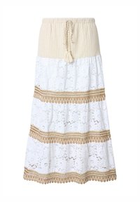 Gonna bianca in pizzo a strati con vita elastica beige e decorazioni. Presenta un cordoncino con nappine e dettagli a trim con motivi.