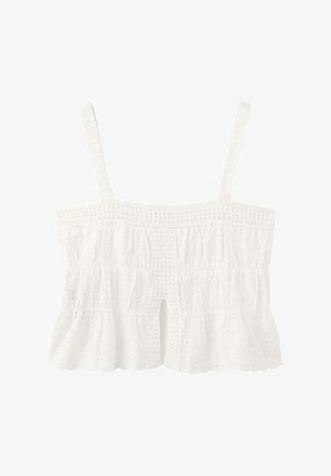Débardeur court en dentelle ajourée blanche avec fines bretelles, détails smockés et petite fente centrale à l'avant.