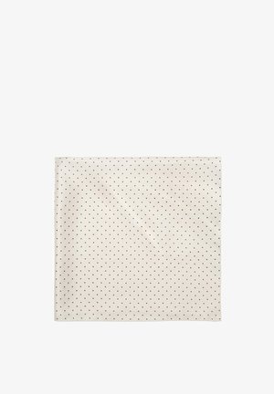 Tessuto quadrato color crema con piccoli pois neri distribuiti uniformemente.