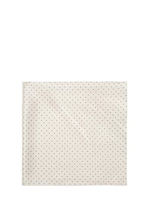 Tissu carré de couleur crème avec de petits pois noirs uniformément espacés.