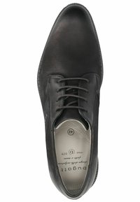 Zapato de cuero negro con textura suave, punta redondeada y diseño con cordones. Presenta un interior cómodo y un logo de marca en relieve. Talla 42.