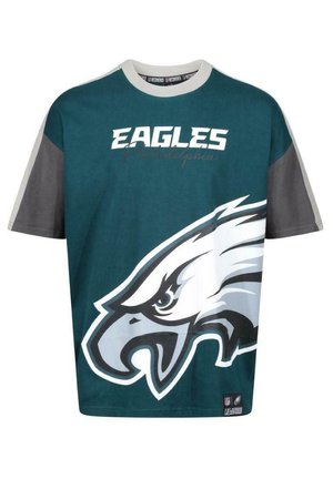 T-shirt in teal en grijs, met een grote adelaar graphic en de tekst 'EAGLES Philadelphia' in het wit. Korte mouwen en een ronde halslijn.