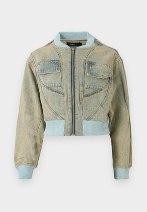 Cropped denim jacket in light blue with a zipper closure, ribbed cuffs, and two front pockets featuring textured accents.