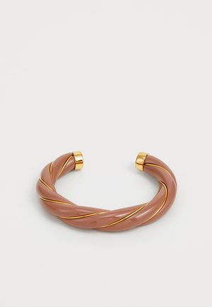 Twisted glossy brown cuff bracelet with thin gold bands spiraling around and gold caps on each open end, set against a white background.