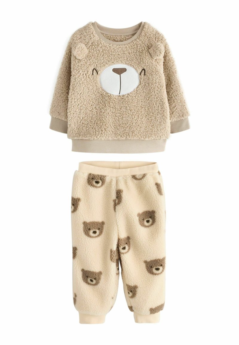 Fleece two-piece outfit featuring a tan bear face on a textured sweater and beige pants with repeated bear faces. Soft and warm fabric.