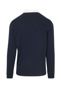 Marineblauwe longsleeve polo met een witte kraag. Ribbelstructuur, zijsplitsen aan de zoom en aansluitende manchetten. Eenvoudig ontwerp, zonder patronen.