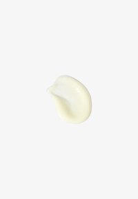 Creamy off-white lotion with a smooth, glossy texture, shaped in a soft, rounded form. The surface appears slightly reflective and viscous.