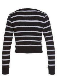 Černo-bílý pruhovaný crop top s ribbovanou texturou, dlouhými rukávy a kulatým výstřihem. Obsahuje úzký pas.