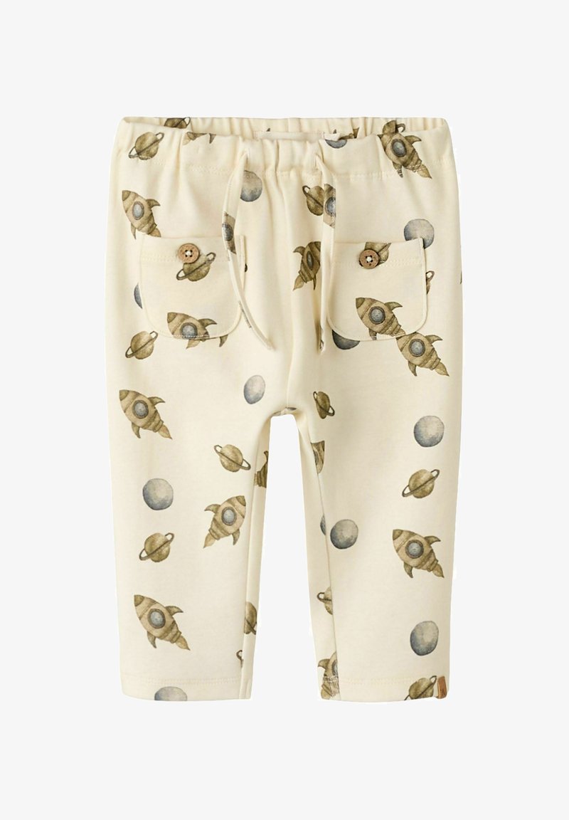 Beżowe spodnie z nadrukiem rakiety i planety. Wykonane z bawełny, z dwiema kieszeniami, elastycznym pasem i sznurkiem do regulacji.