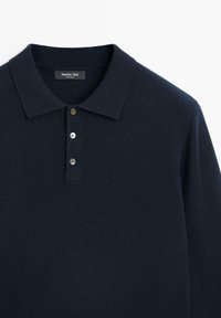 Navy blue knitted polo shirt with a soft texture, three button placket, and a classic collar. Label reads "Massimo Dutti."