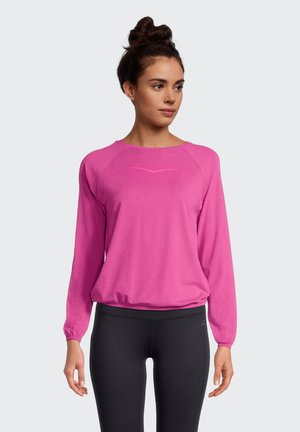 Pinkes langärmliges Sportoberteil mit Rundhalsausschnitt und Raglanärmeln. Verfügt über ein dezentes Logodetail auf der Brust und einen eng anliegenden Bund.
