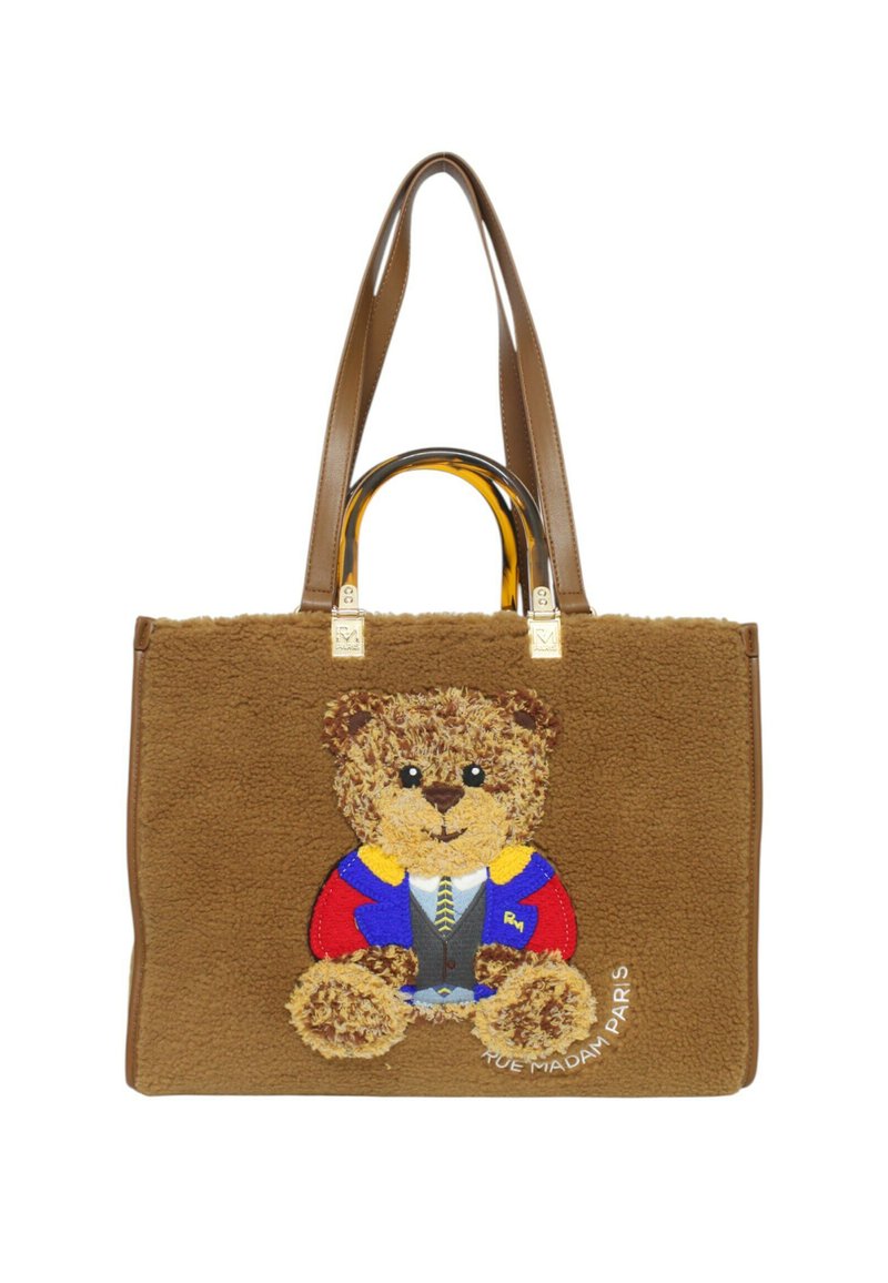 Borsa tote in shearling marrone con design di orsetto. Presenta manici trasparenti e accessori in oro. Gli accenti includono dettagli ricamati colorati.