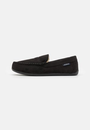 Black suede moccasin slip-on shoe with a stitched front, soft interior lining, and a low rubber sole. Features a "POLO" logo on the side.