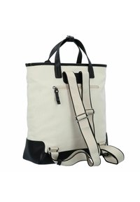 Borsa tote in tela con corpo crema, dettagli in pelle nera, doppie maniglie superiori, tracolla regolabile e una tasca con zip sul retro.