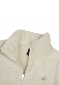 Fleece-pullover i ljusbeige med hög krage, dragkedja och texturerad yta. Har en rund logotyp och mjukt tyg.