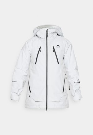 Bílá nepromokavá bunda s kapucí, která má dvě přední kapsy se zipem a černé zipové detaily. Vyrobena z materiálu GORE-TEX.