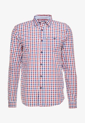 Camicia a maniche lunghe con bottoni, motivo a quadri rosso, blu e bianco e una singola tasca sul petto con bottone.