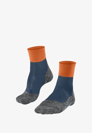 Two pairs of knee-high socks with an orange ribbed cuff, blue body, and gray patterned foot sections, displayed upright and side by side.