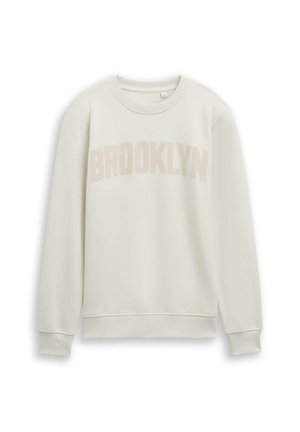 Lichtcrème sweatshirt met een ronde hals en lange mouwen. "BROOKLYN" in een zachte roze kleur gedrukt op de borst. Soepele textuur, geribde manchetten.