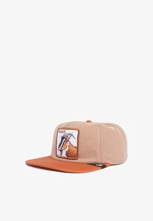 Cap with a beige fabric crown and orange peak. Features an embroidered goat patch labeled "G.O.A.T." on the front. Textured peak.