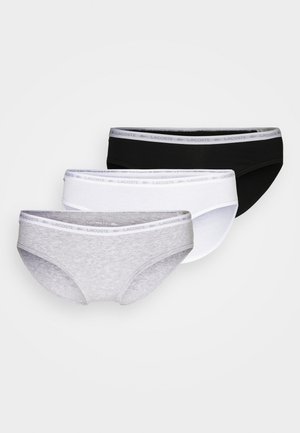 Three pairs of women's briefs: black, white, and light gray. Each features a soft elastic waistband with "Lacoste" logo and a smooth cotton texture.