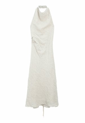 Sleeveless, halter neck dress in light beige with a grid pattern. Soft fabric, flowing shape, and adjustable tie detail at the back.