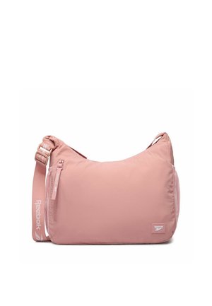 Różowa torba na ramię Reebok z regulowanym paskiem, przednią kieszenią na suwak oraz boczną kieszenią z siateczki, z logo Reebok na pasku i przednim panelu.