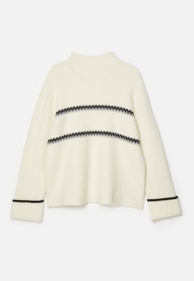 Balts adīts džemperis ar augstu apkakli, ar horizontālām melnām un pelēkām svītrām un melniem akcentiem uz piedurknēm. Mīksta tekstūra.