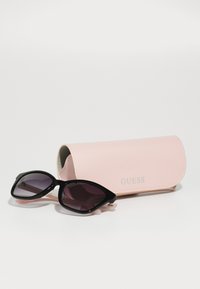 Guess Sončna očala - shiny black/gradient smoke