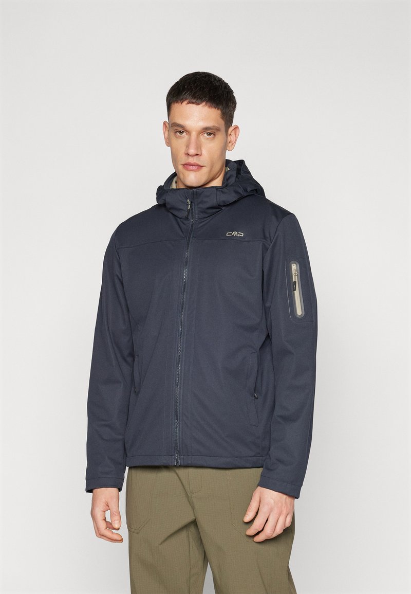 Navy blue waterproof jacket with a zippered front, adjustable hood, and side pockets. Features a logo on the chest and a zippered arm pocket.
