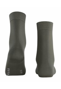 Olivgrüne Socken aus weichem Stoff, mit glatter Textur und verstärktem Fersenbereich. Sichtbares Markenlogo an der Seite.