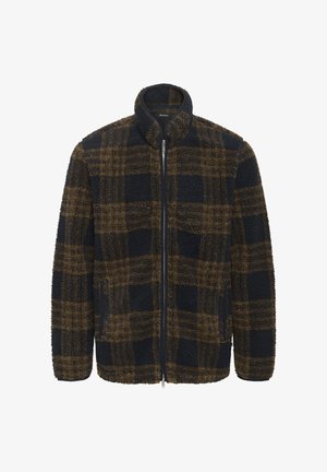 Veste en polaire à carreaux marron et noirs avec fermeture éclair sur toute la longueur à l'avant et col montant, présentée sur un fond blanc.