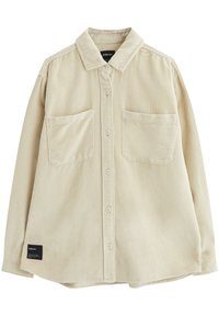 Chemise en velours côtelé beige avec col, fermeture à boutons, deux poches poitrine et ourlet droit. Présente une texture à côtes verticales.