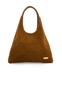 Brown suede tote bag with a slouchy hobo shape, a single shoulder strap, and a small metal logo accent on the side.
