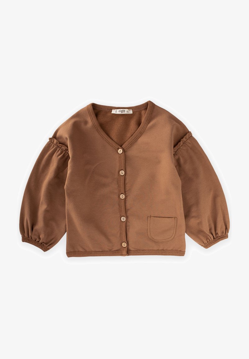 Cardigan in cotone marrone con scollo a V, 6 bottoni in legno e maniche a sbuffo. Presenta una piccola tasca sul lato sinistro. Tessuto morbido.