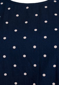 Tessuto navy con pois bianchi. Texture liscia con scollatura rotonda e motivo a pois distribuito uniformemente su tutto il materiale.