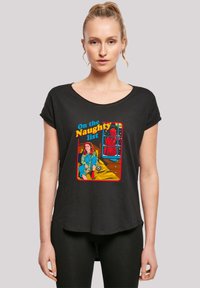 Black short-sleeve T-shirt featuring a colorful graphic print of a girl sitting on a bed with the text "On the Naughty List" above.