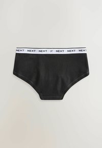 Musta puuvillabriif, valge riba tekstiga "NEXT." Sile tekstuur, kõrge vöökoht ja klassikaline lõige.