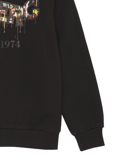 Felpa nera con stampa grafica colorata effetto gocciolante, polsini a coste e vestibilità rilassata. Contrassegnata con "1974".