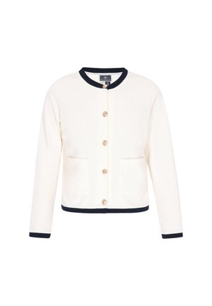 Valkoinen neuletakki pitkillä hihoilla, pyöreällä tummansinisellä kauluksella ja tummansinisillä hihansuihilla. Sisältää viisi nappia ja kaksi etutaskua. Tasainen rakenne.