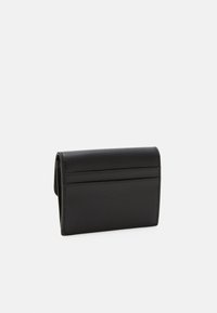 Black leather wallet with a smooth texture, rectangular shape, and multiple card slots on one side. Stitched edges are visible.