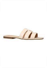 Sandale slide beige clair avec trois larges bandes, semelle plate et design minimaliste. Texture lisse avec des détails cousus sur les bandes.