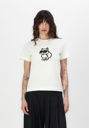 Kremfarget bomulls-t-skjorte med et grafisk design av en rev som har solbriller, med svarte og røde detaljer på designet. Korte ermer og rund hals.