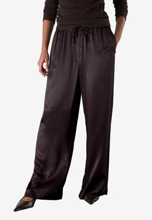 Satin, wide-leg pants in dark purple with a drawstring waist, featuring side pockets and a smooth, glossy texture.