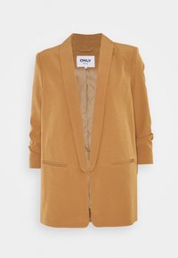 Hořčicově zbarvený blejzr s klopou na záhyb, dvěma předními kapsami a vyhrnutými rukávy. Hladká látka s čistým, dobře střiženým designem.