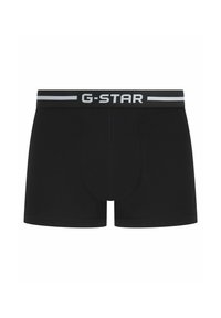 Boxer-briefs noirs en tissu extensible avec une ceinture de marque G-STAR arborant des lettres grises et un design minimaliste.